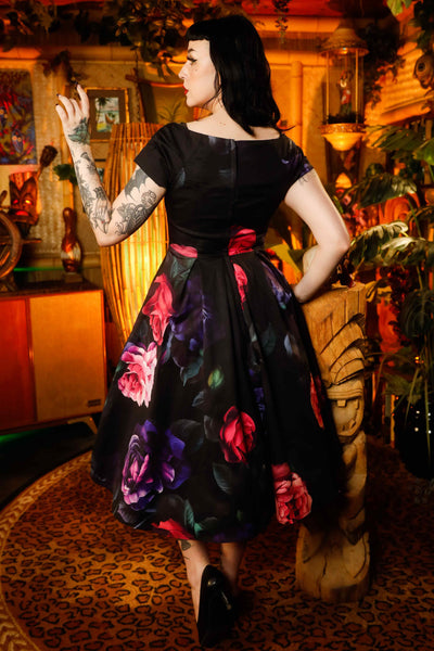 A model wearing a Peony Garden Off Shoulder Dress
