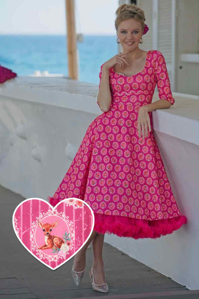 A lady wearing a Pink Baby Deer Midi Dress