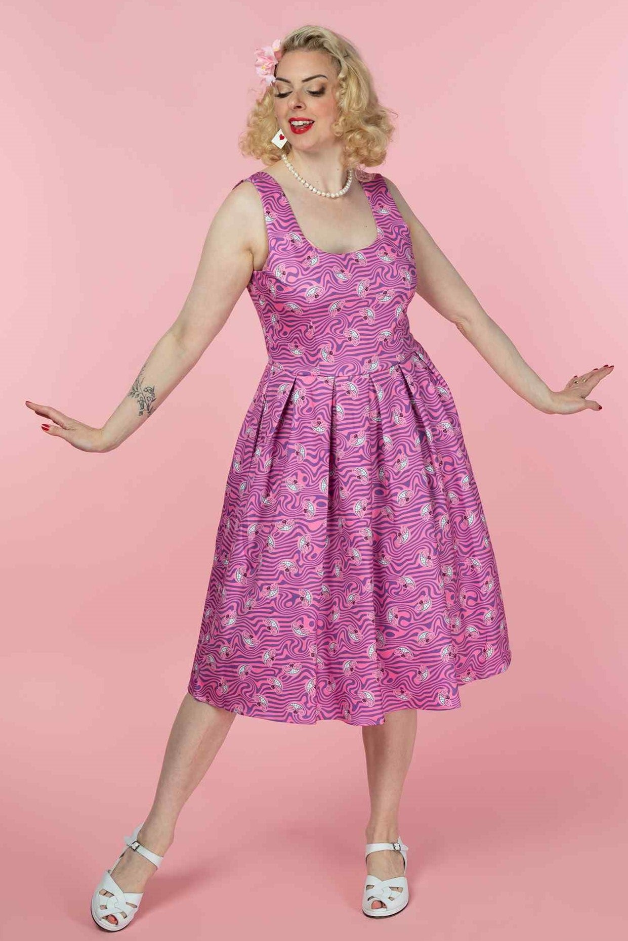 A model wearing a  Pink Cheshire Cat Swing Dress