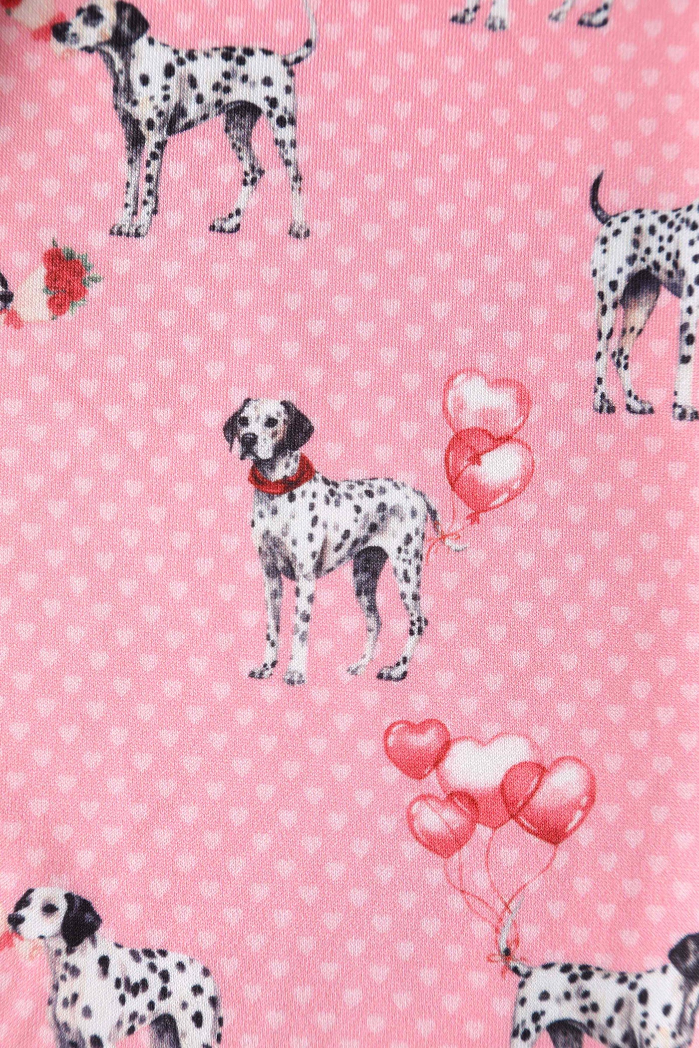 Close up of pink dalmatian dog and heart balloons fabric 