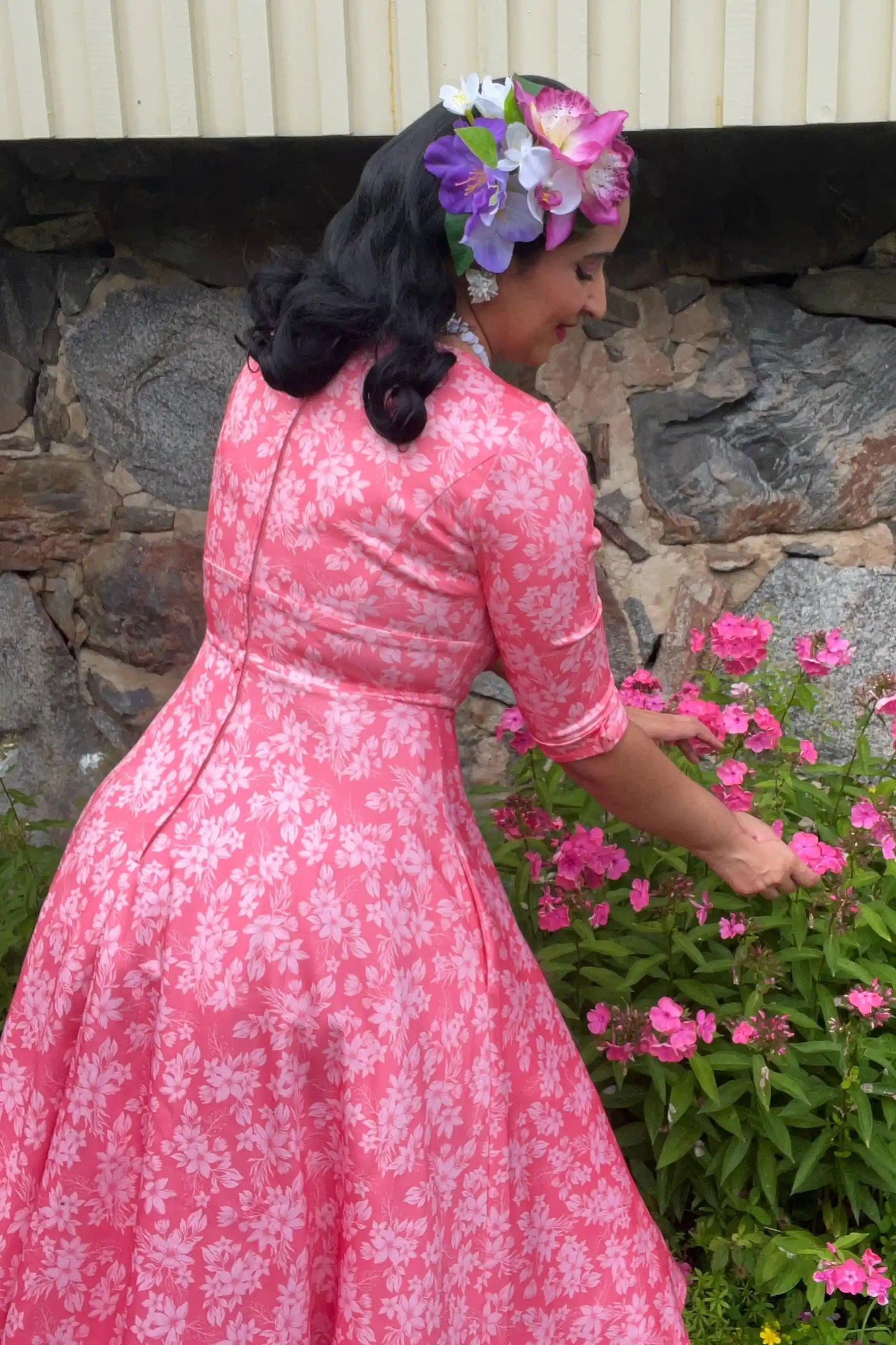 A lady wearing a Pink Floral Garden Circle Dress