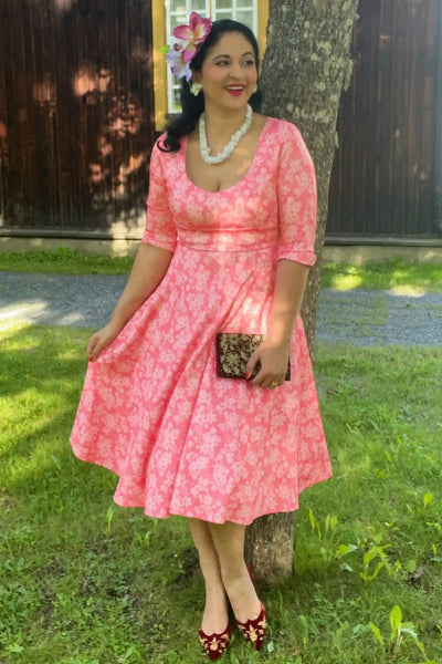 A lady wearing a Pink Floral Garden Circle Dress