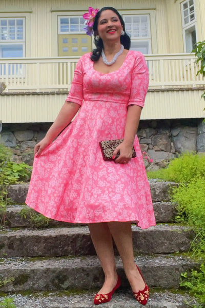 A lady wearing a Pink Floral Garden Circle Dress