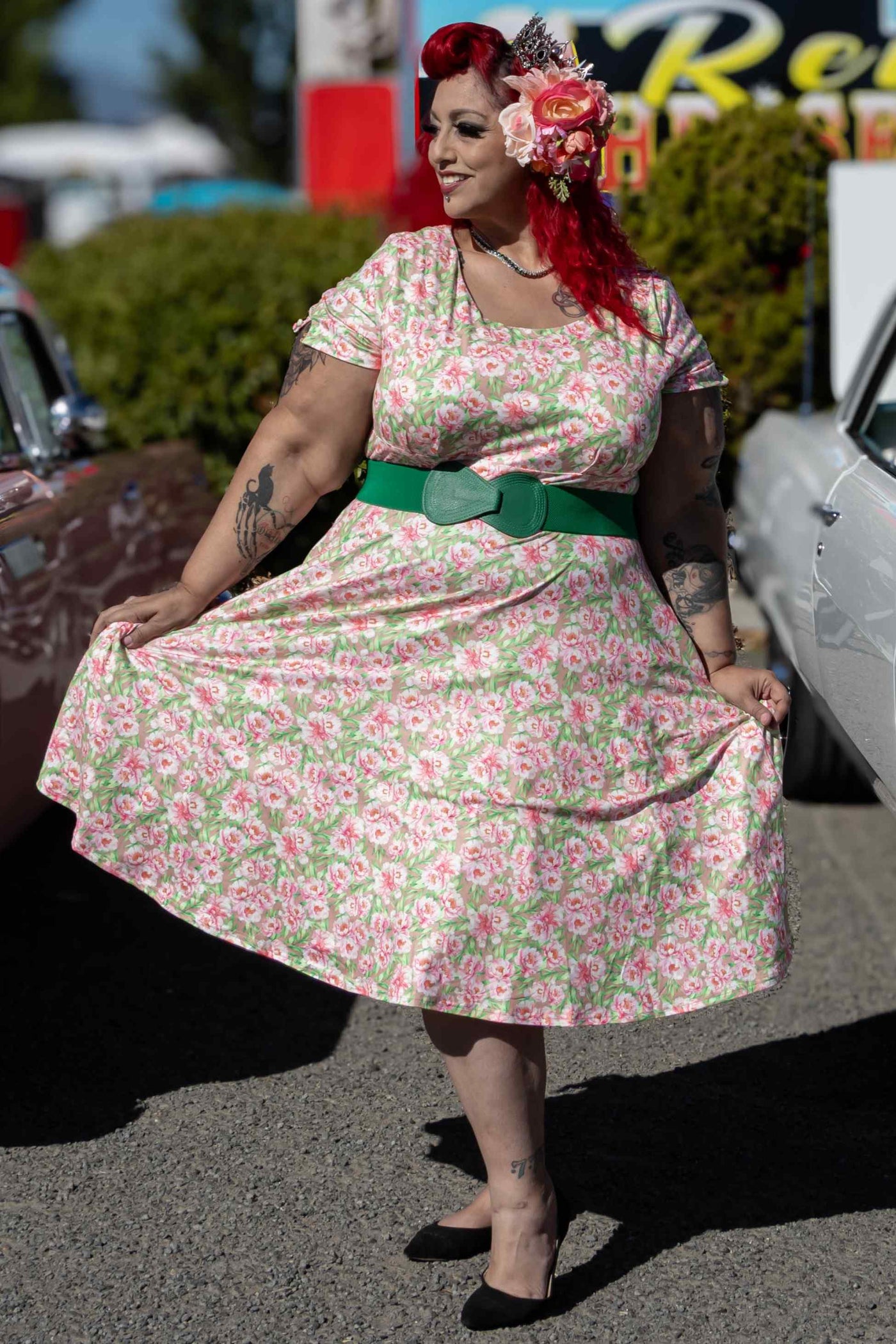 A lady wearing a Pink Floral Short Sleeved Dress