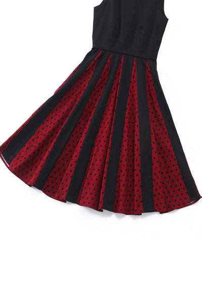 Close up view of Pleated Black Dress With Burgundy Polka Dots