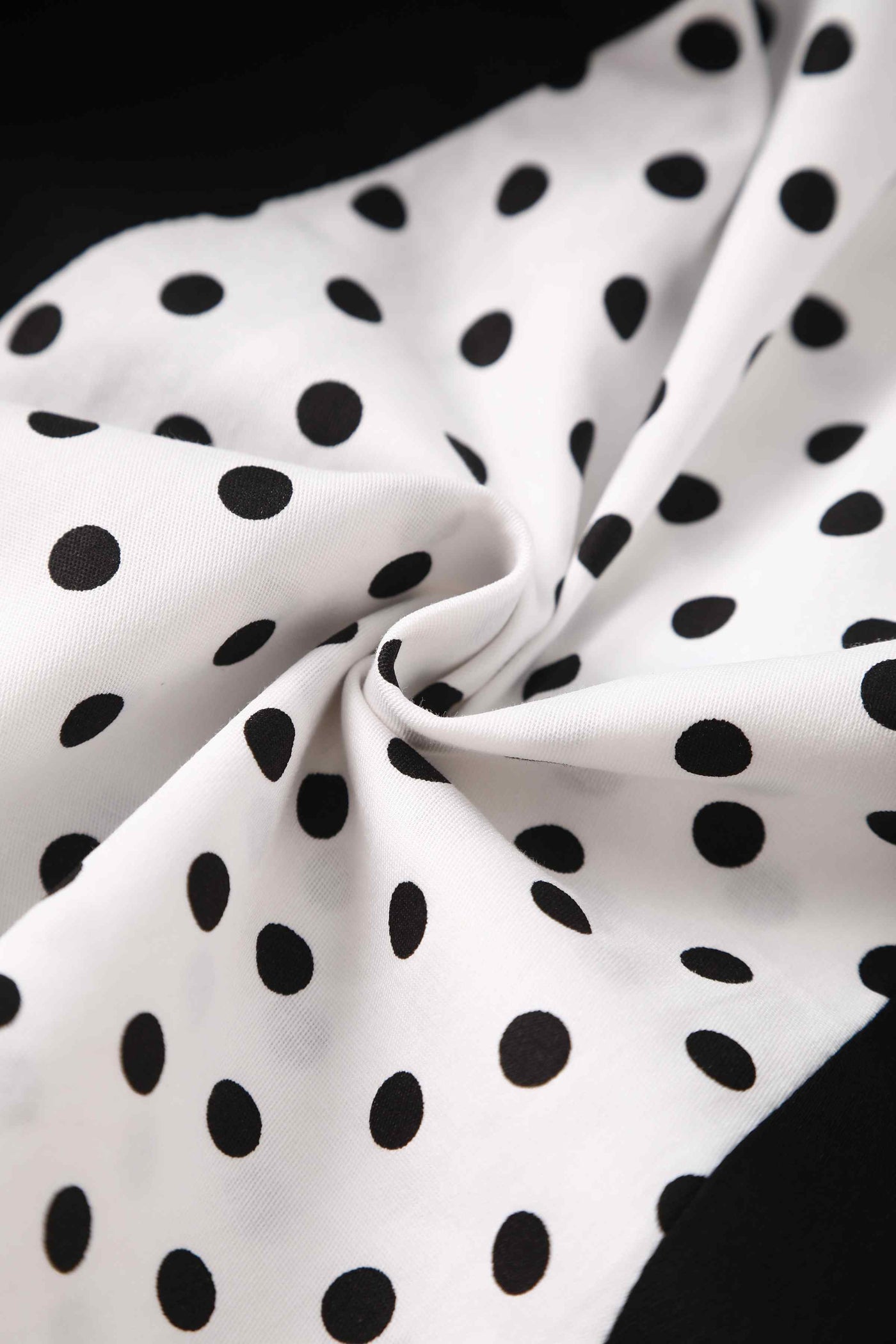 Close up view of Pleated Black Dress With White Polka Dots