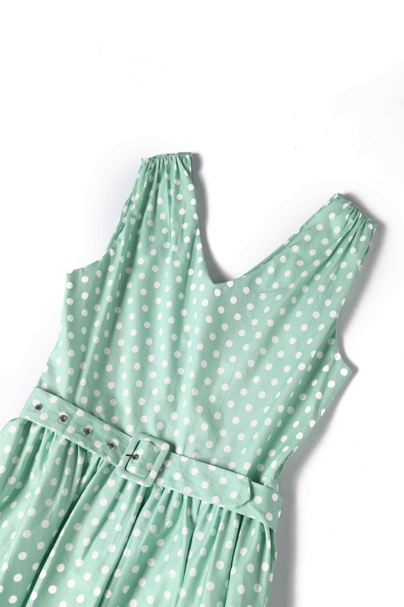 Close up view of Polka Dot Swing Dress in Mint Green