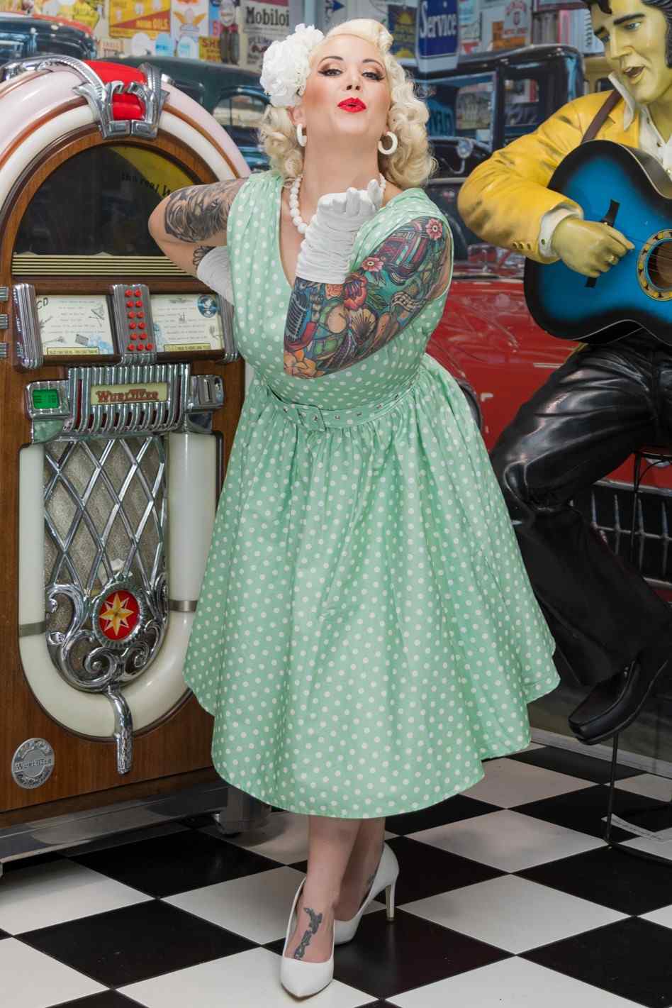 Model wearing a Polka Dot Swing Dress in Mint Green