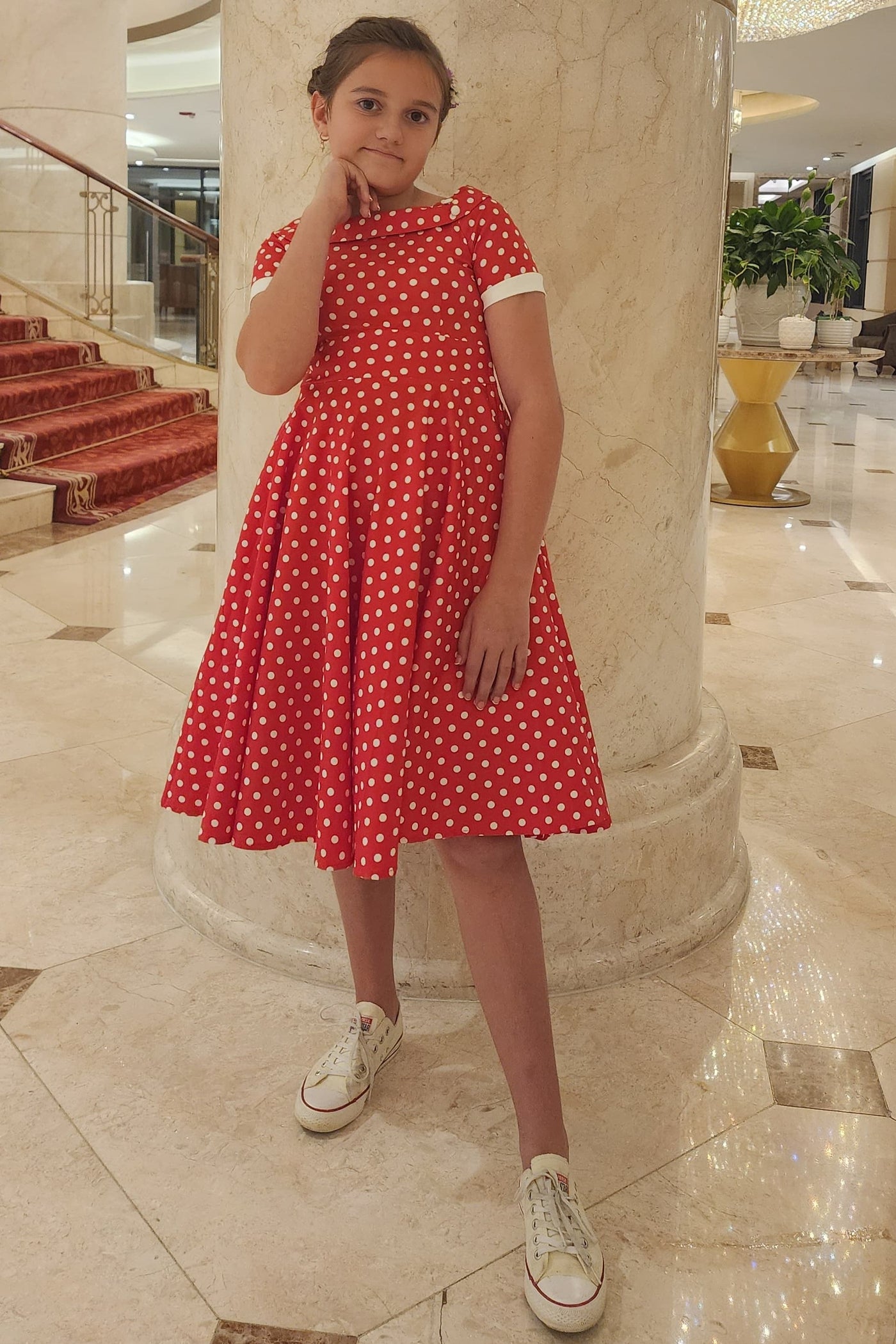 A pretty girl wearing a Polka Dot Swing Dress In Red & White