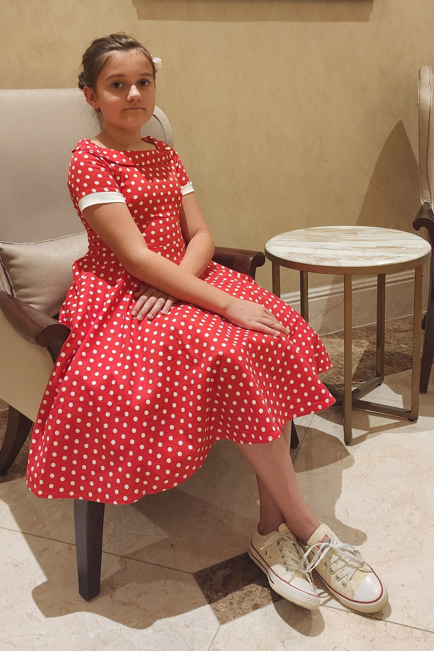 A pretty girl wearing a Polka Dot Swing Dress In Red & White