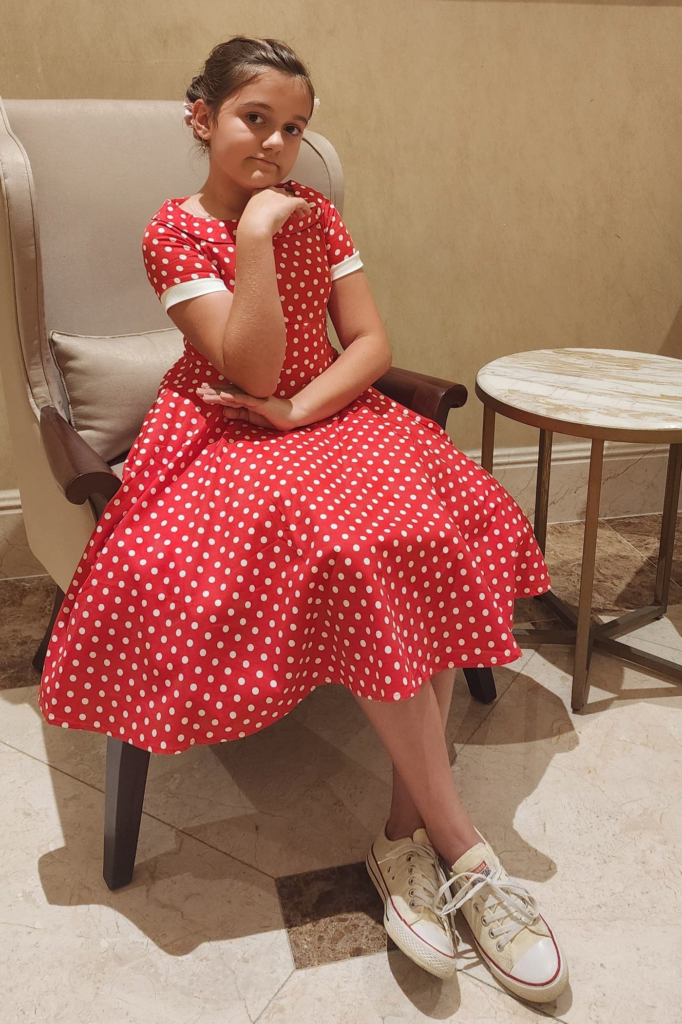 A pretty girl wearing a Polka Dot Swing Dress In Red & White