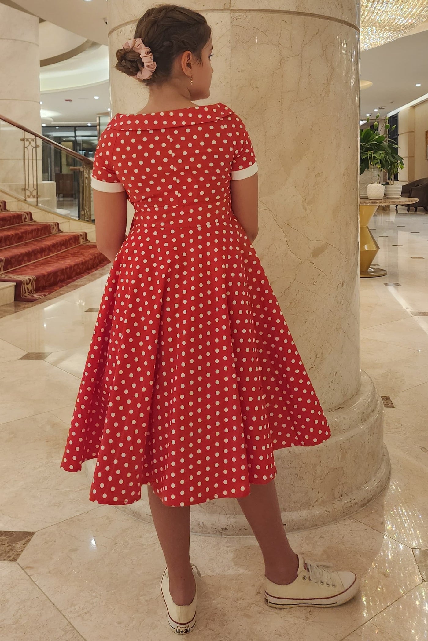 A pretty girl wearing a Polka Dot Swing Dress In Red & White