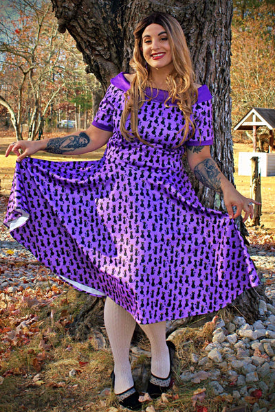 A model wearing Purple Black Cat Swing Dress