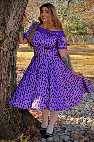 A model wearing Purple Black Cat Swing Dress