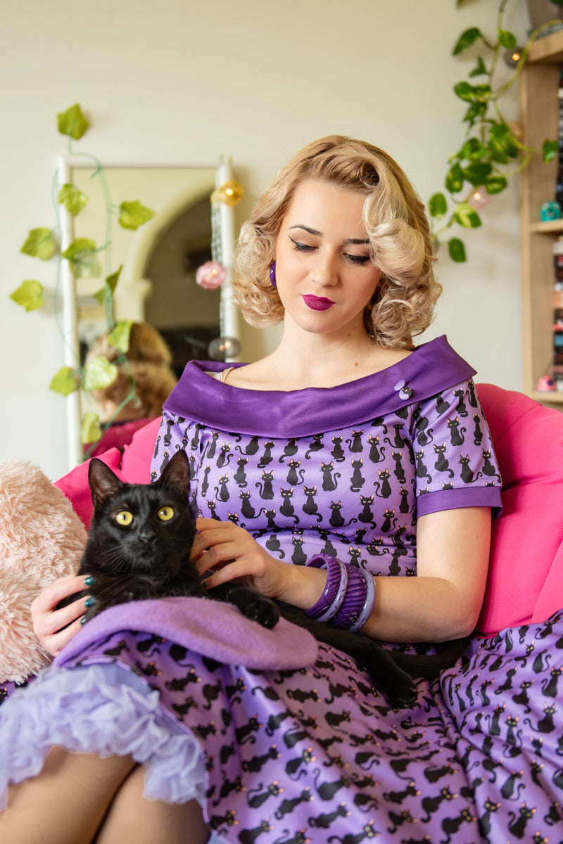 A model wearing a  Purple Black Cat Swing Dress