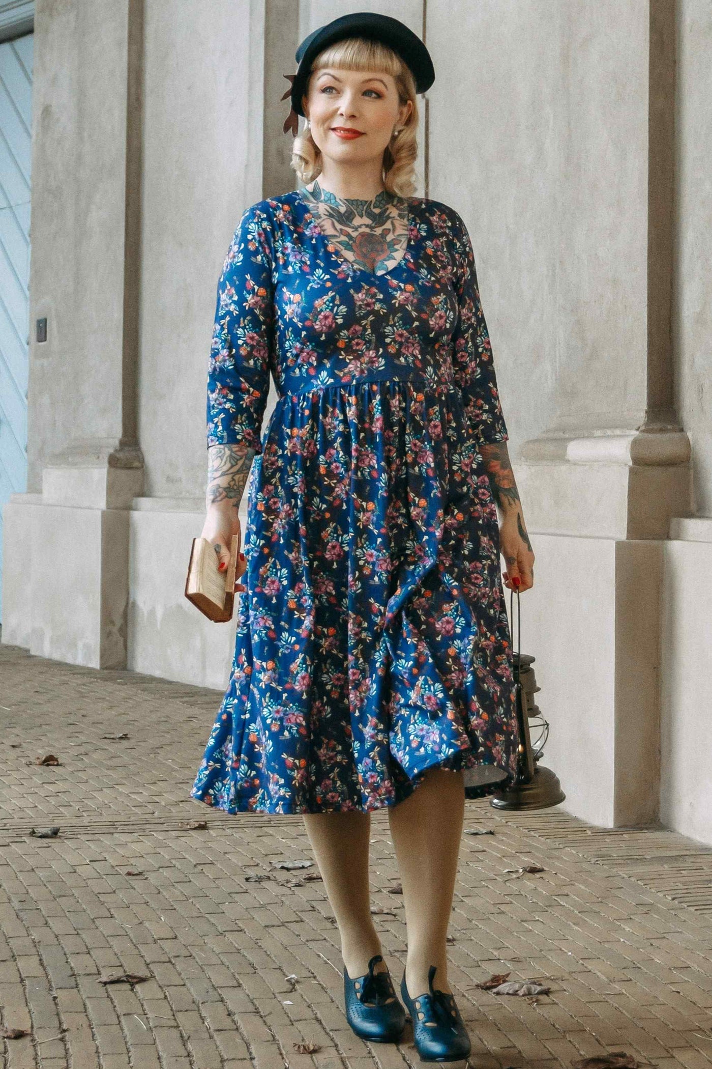 Customer wears our purple long sleeved dress in floral dragonfly print