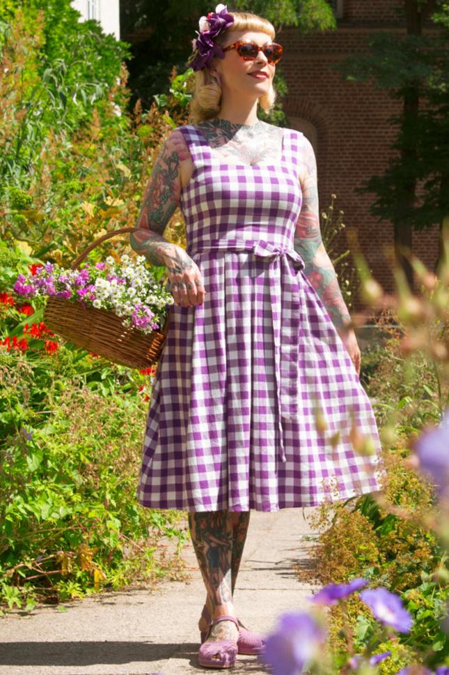 A lady wearing a Purple Gingham Swing Dress