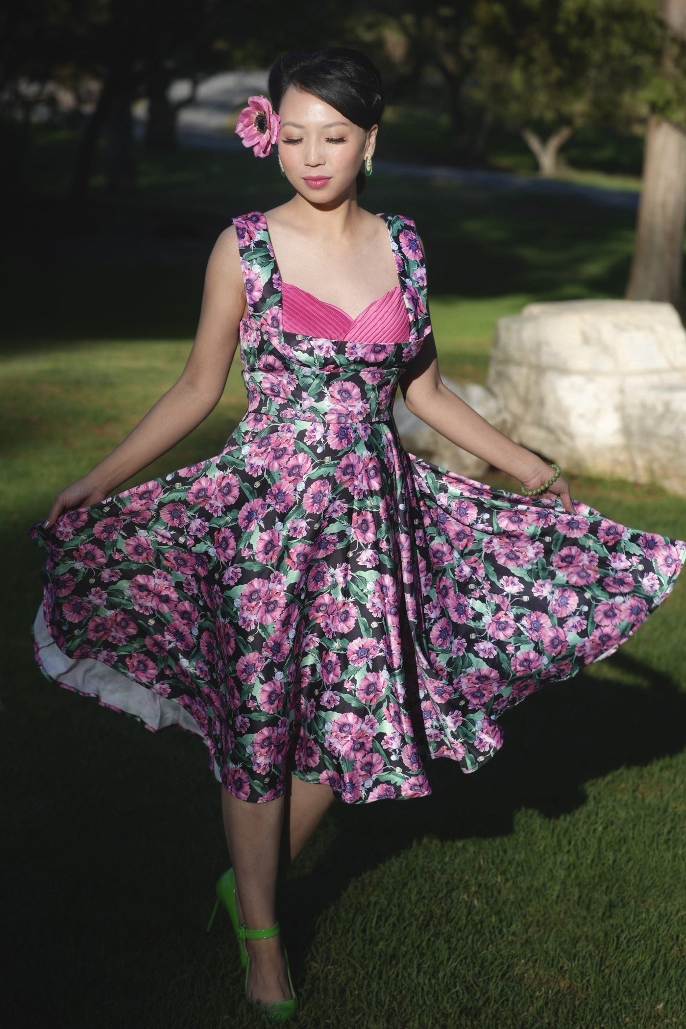 A lady wearing a Purple Poppy Pleated Bust Dress