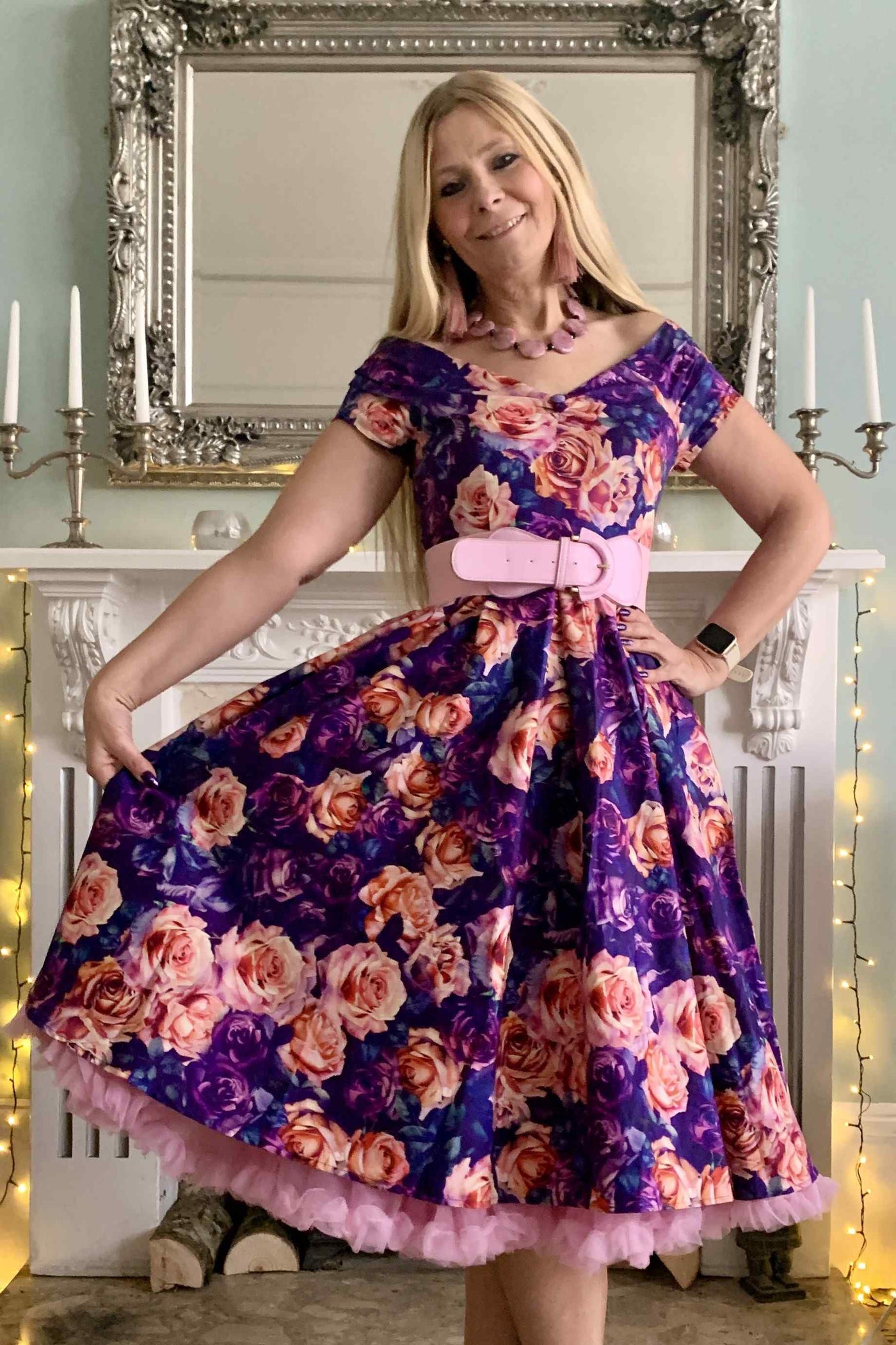 A lady wearing a Purple Rose Garden Off Shoulder Dress