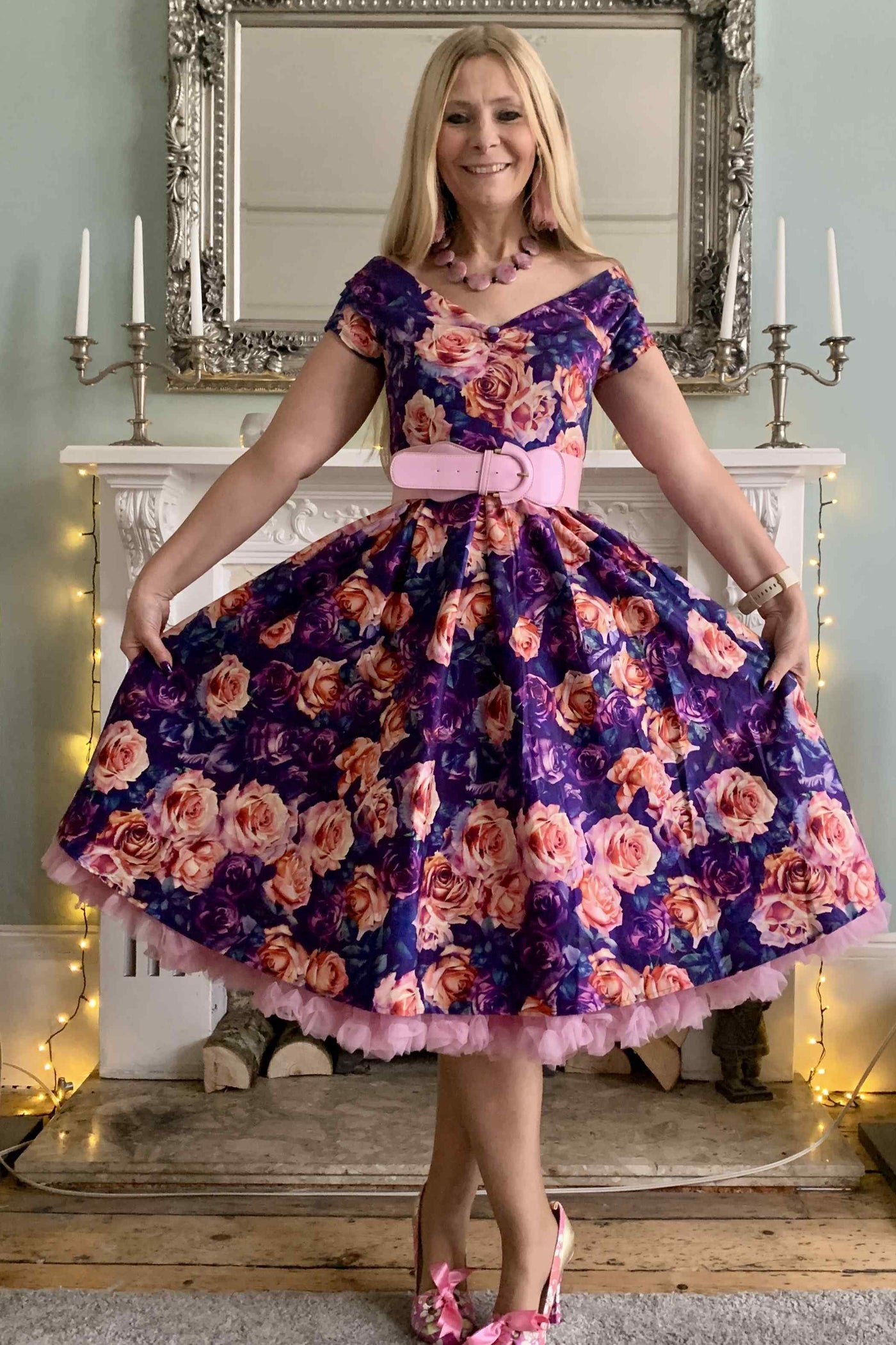 A lady wearing a Purple Rose Garden Off Shoulder Dress