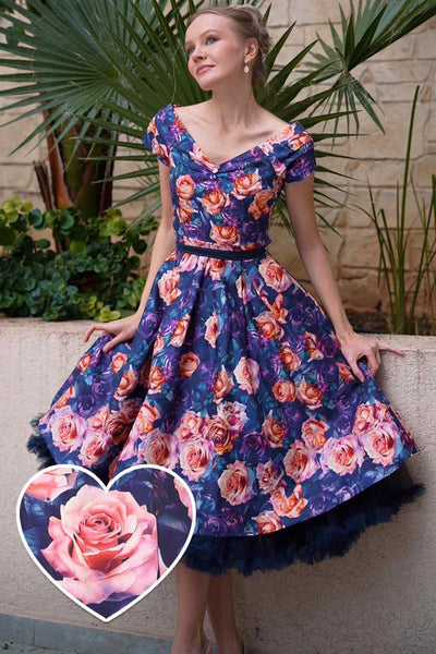 A lady wearing a Purple Rose Garden Off Shoulder Dress