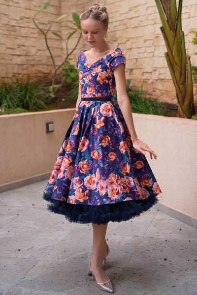 A lady wearing a Purple Rose Garden Off Shoulder Dress