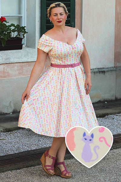 A model wearing a Rainbow Cat White Off Shoulder Dress