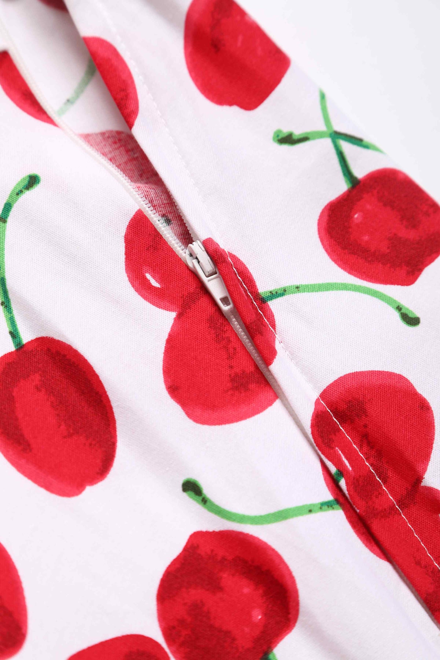 Close up view of Red Cherry Dress In White