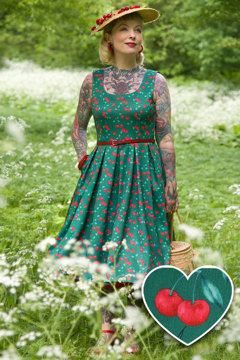 A model wearing a Red Cherry Flared Dress In Green