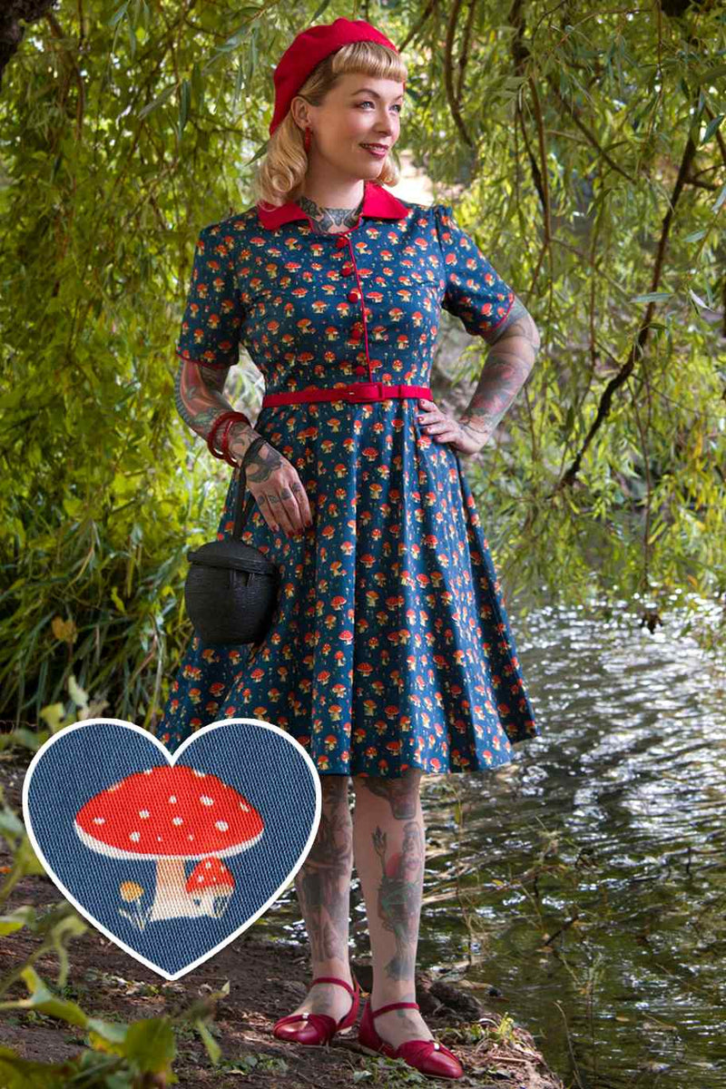 A model wearing a Red Mushroom Shirt Dress in Blue