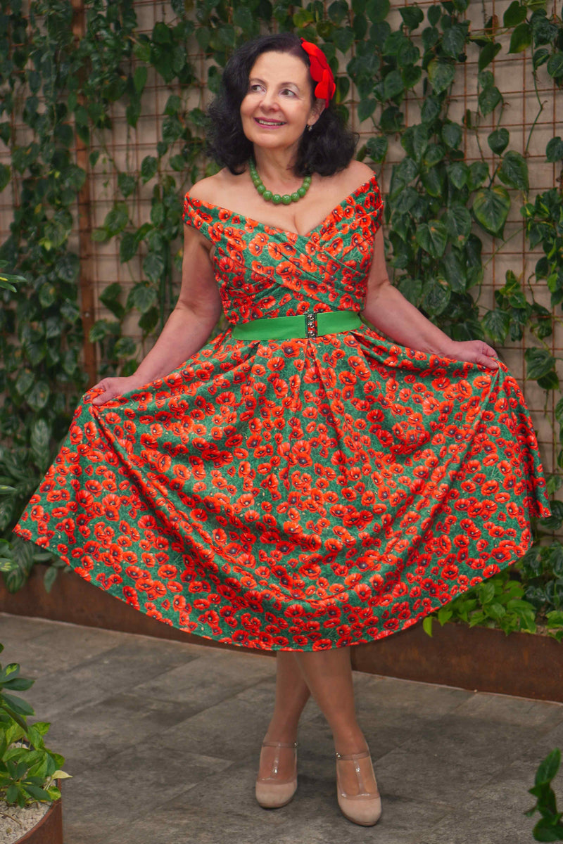 A lady wearing a Red Poppy Garden Off Shoulder Dress