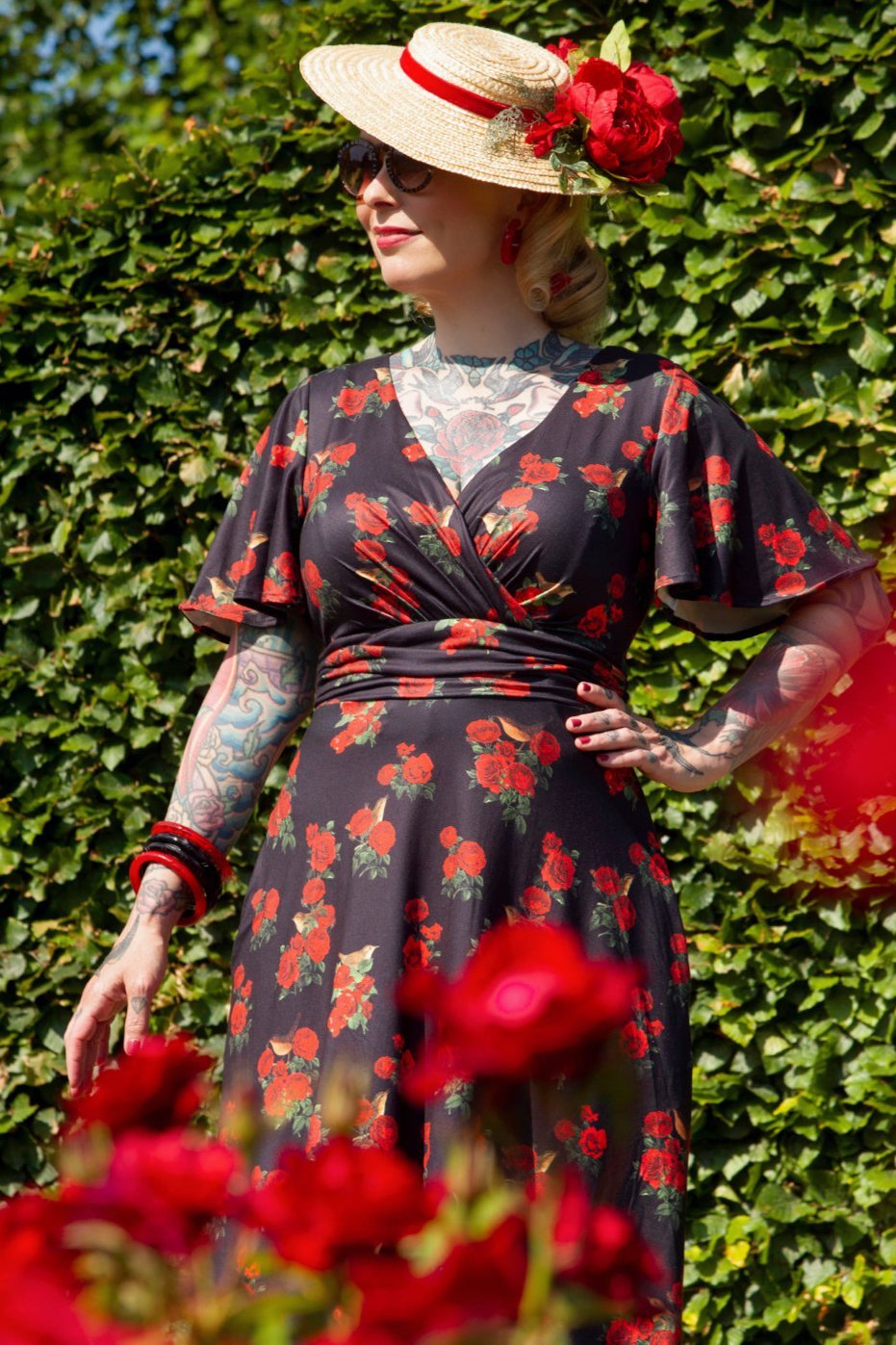 A model wearing Red Rose Crossover Bust Dress