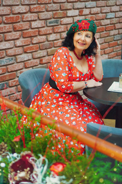 A model wearing Red Snowman Midi Dress