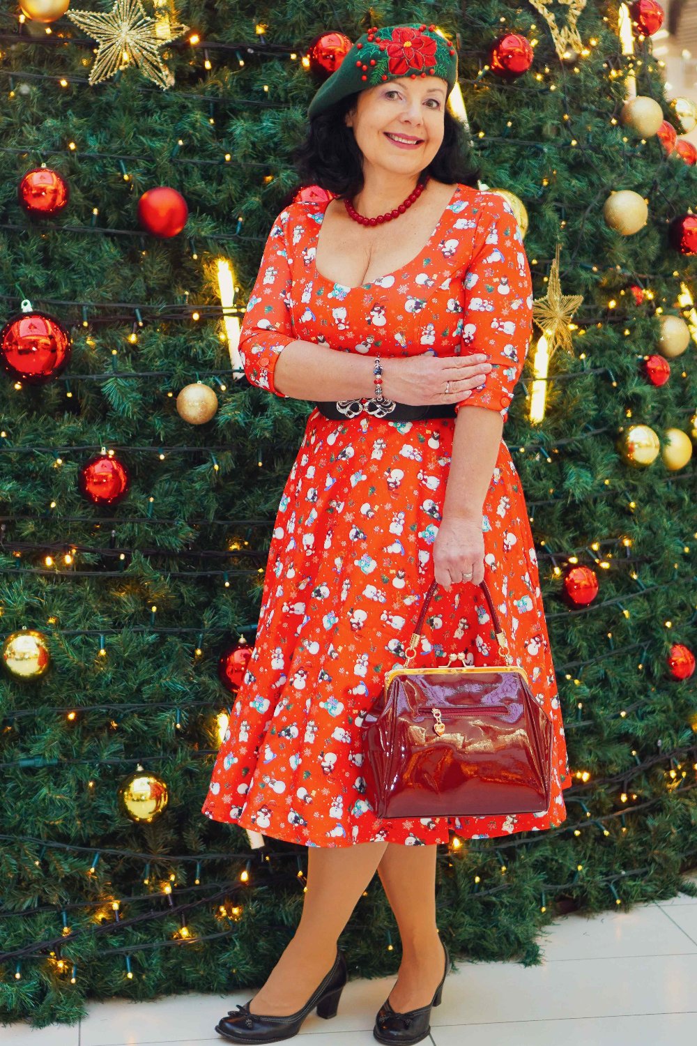 A model wearing Red Snowman Midi Dress