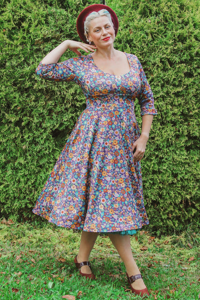 A model wearing a Retro 70s Floral Garden Dress