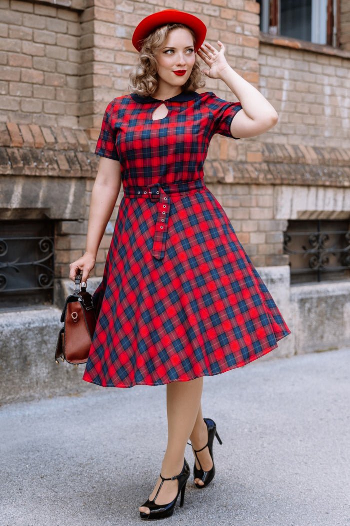 A model wearing a Retro Check Swing Dress in Red