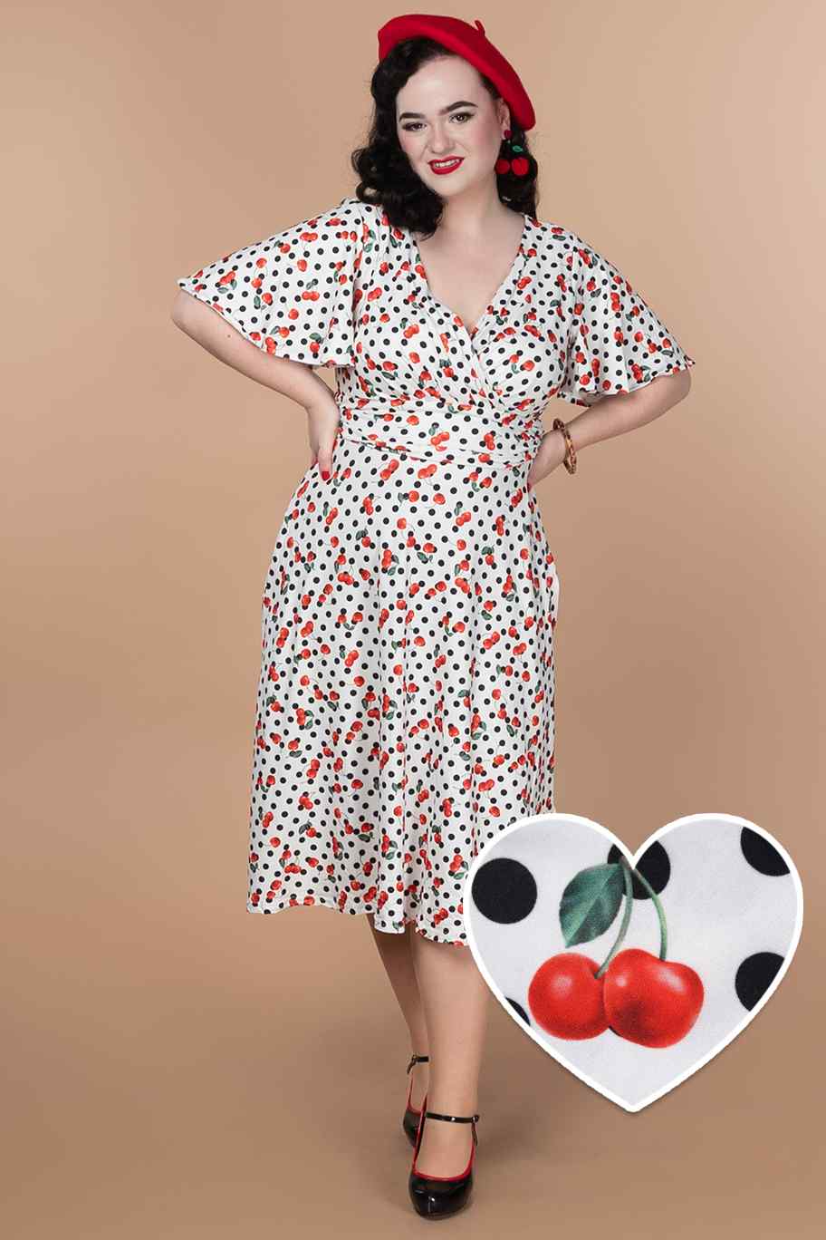 A model wearing a Retro Cherry Polka Dot Dress