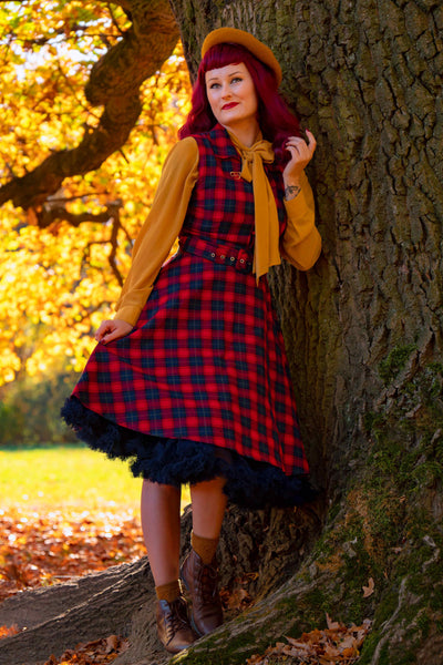 A model wearing Retro Swing Shirt Dress in Red Tartan