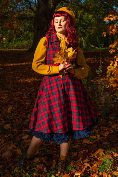 A model wearing Retro Swing Shirt Dress in Red Tartan