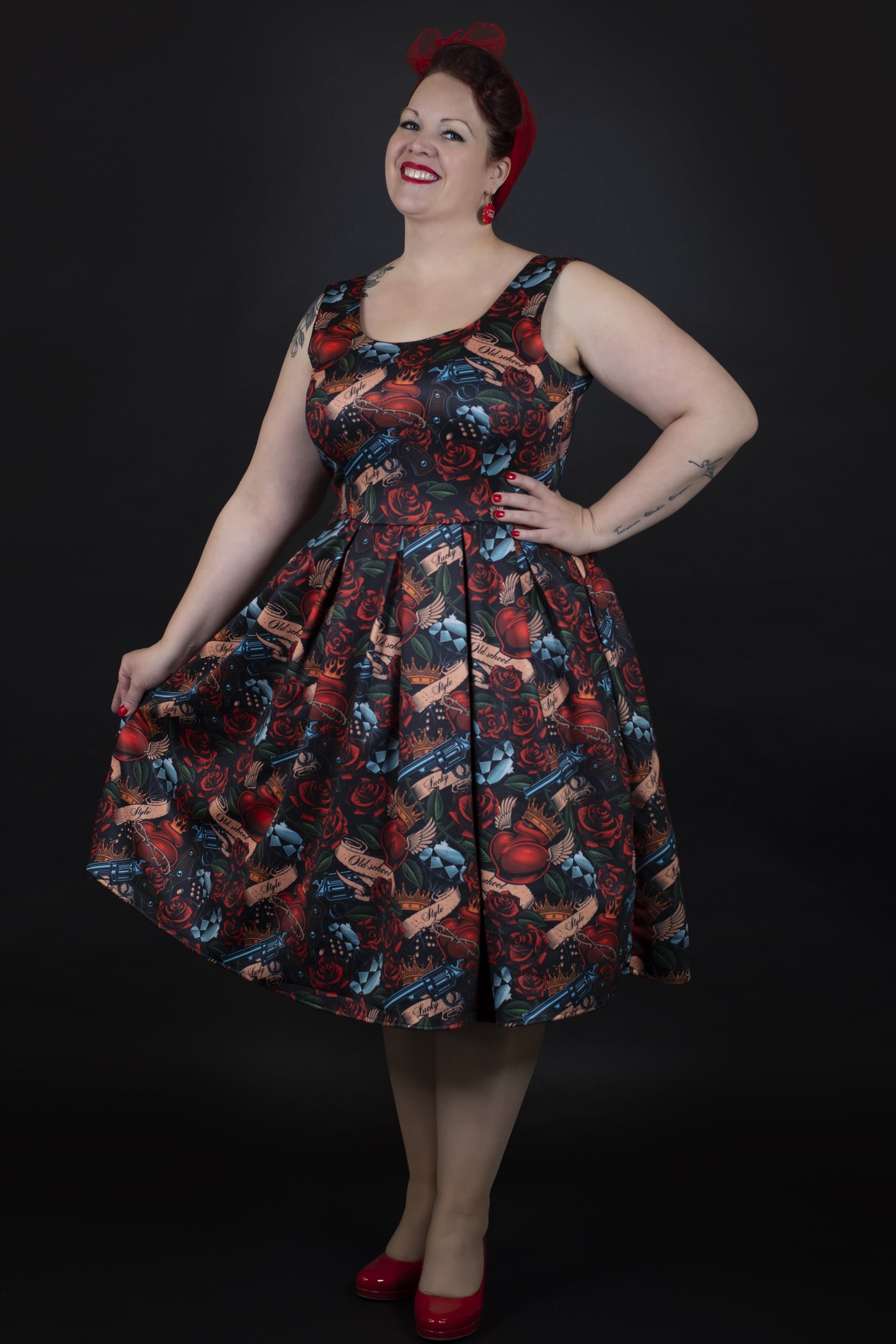 A model wearing a Rockabilly Guns N' Roses Swing Dress