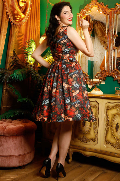 A model wearing a Rockabilly Guns N' Roses Swing Dress