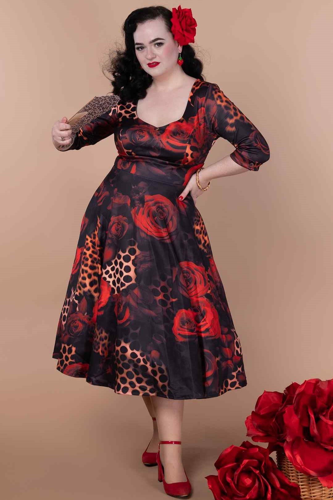 A model wearing a ockabilly Leopard Rose Midi Dress