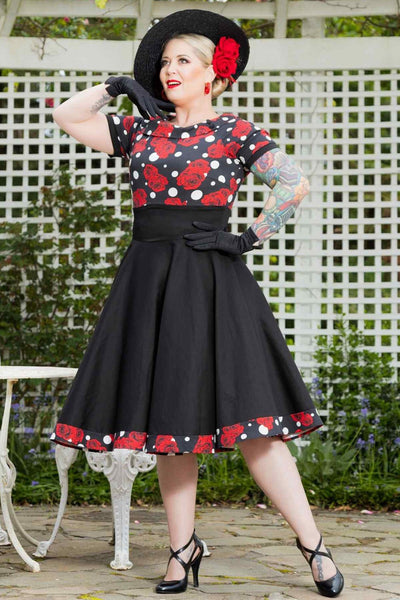 A model wearing Rockabilly Rose Polka Dot Swing Dress