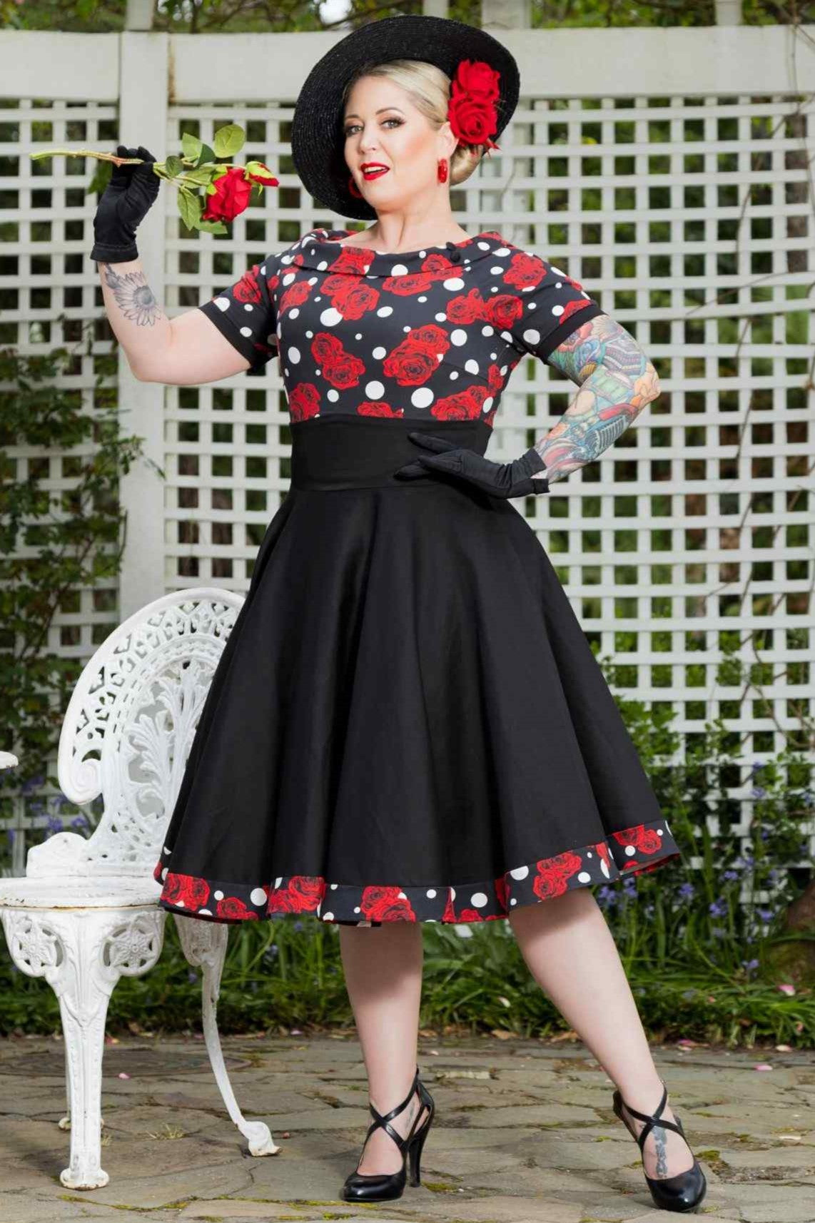 A model wearing Rockabilly Rose Polka Dot Swing Dress