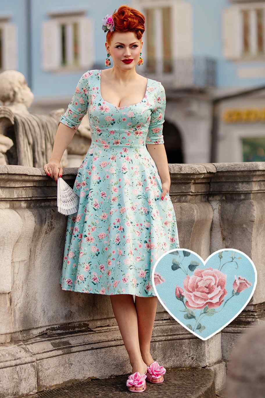 A model wearing a Rose Baby Blue Midi Dress