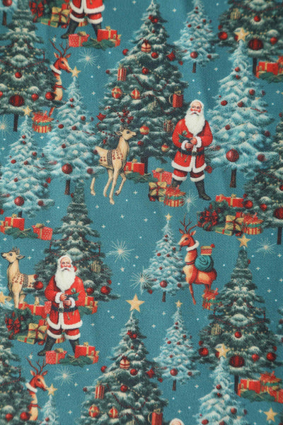 Close up view of Santa & Reindeer Green Circle Dress