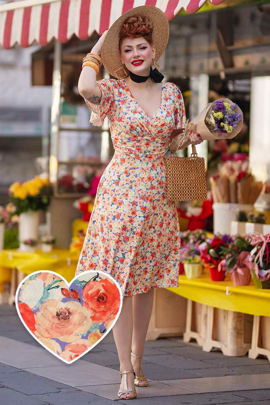 A lady wearing a Short Sleeve Tea Dress in Orange Floral Print