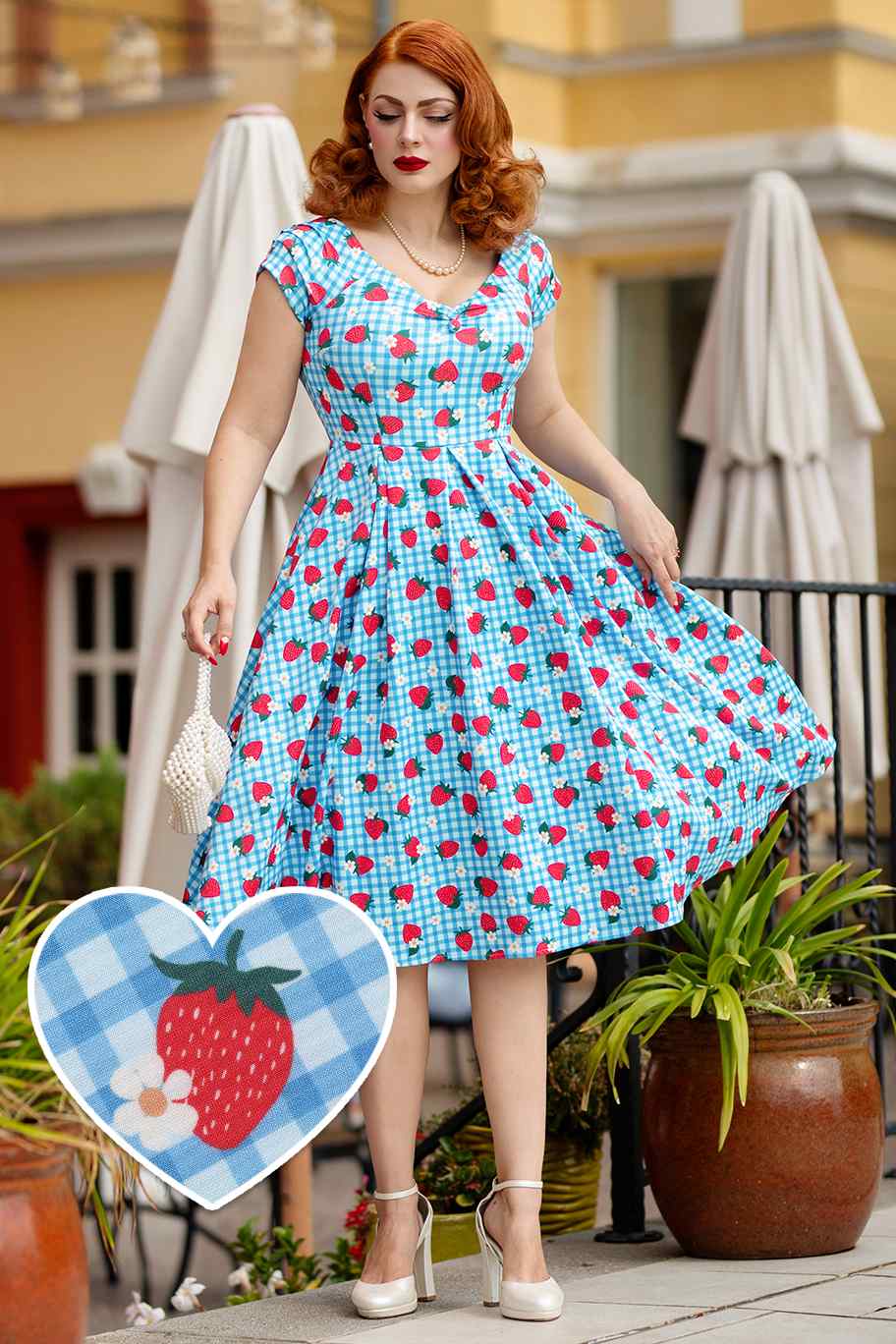 A lady wearing a Summer Strawberry Blue Gingham Dress