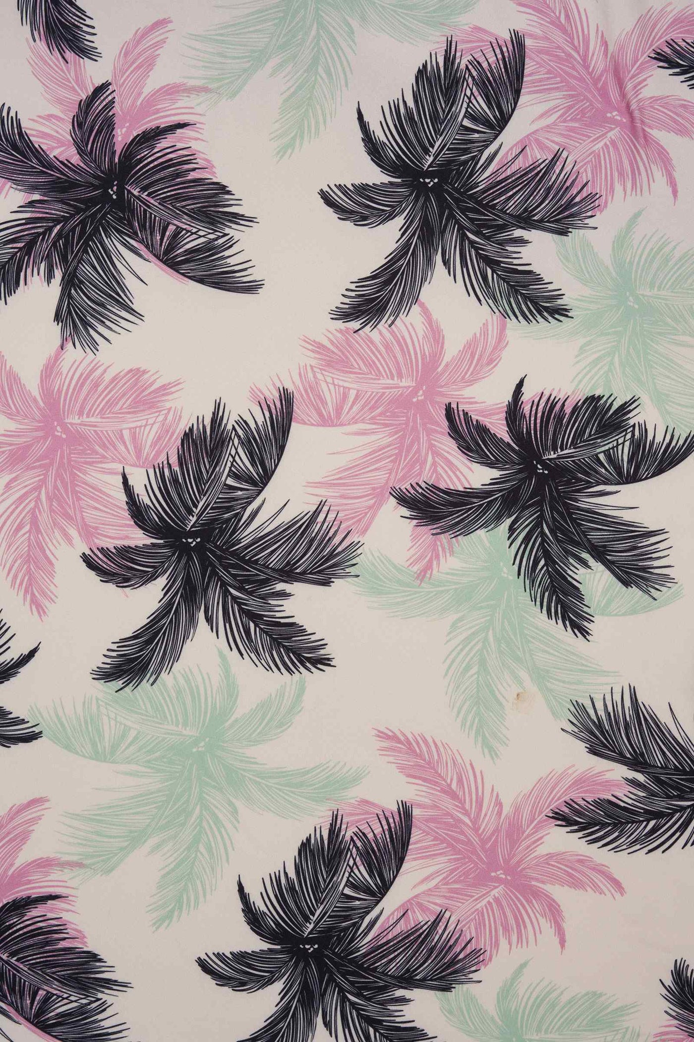 Fabric close up for white/black/green/pink palm tree print