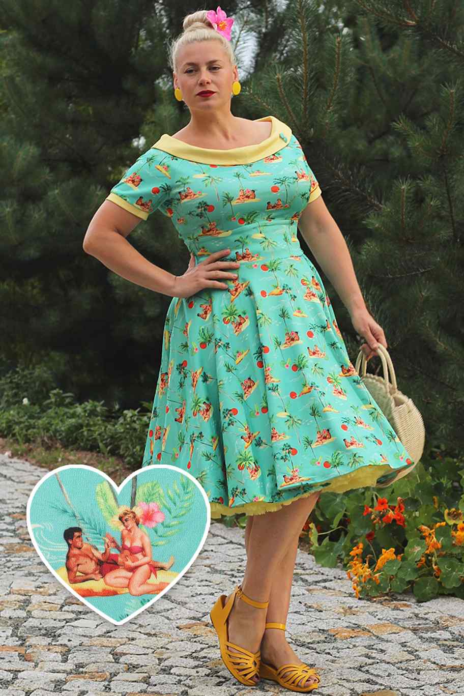 A model wearing Turquoise Pinup Swing Dress in Tropical Island Print